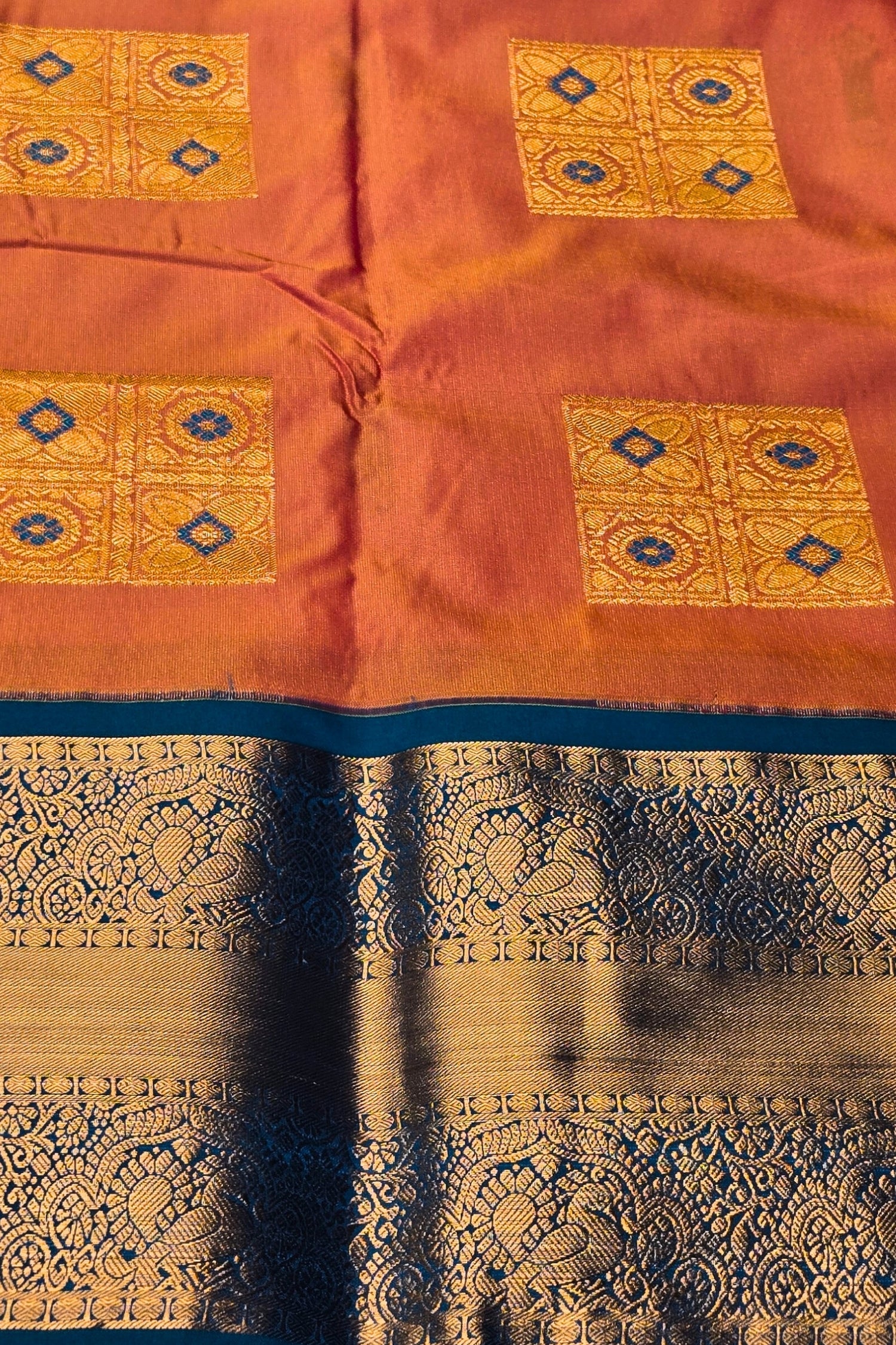 Vibrant Orange Semi Kanchi Silk Saree with Sky Blue Border