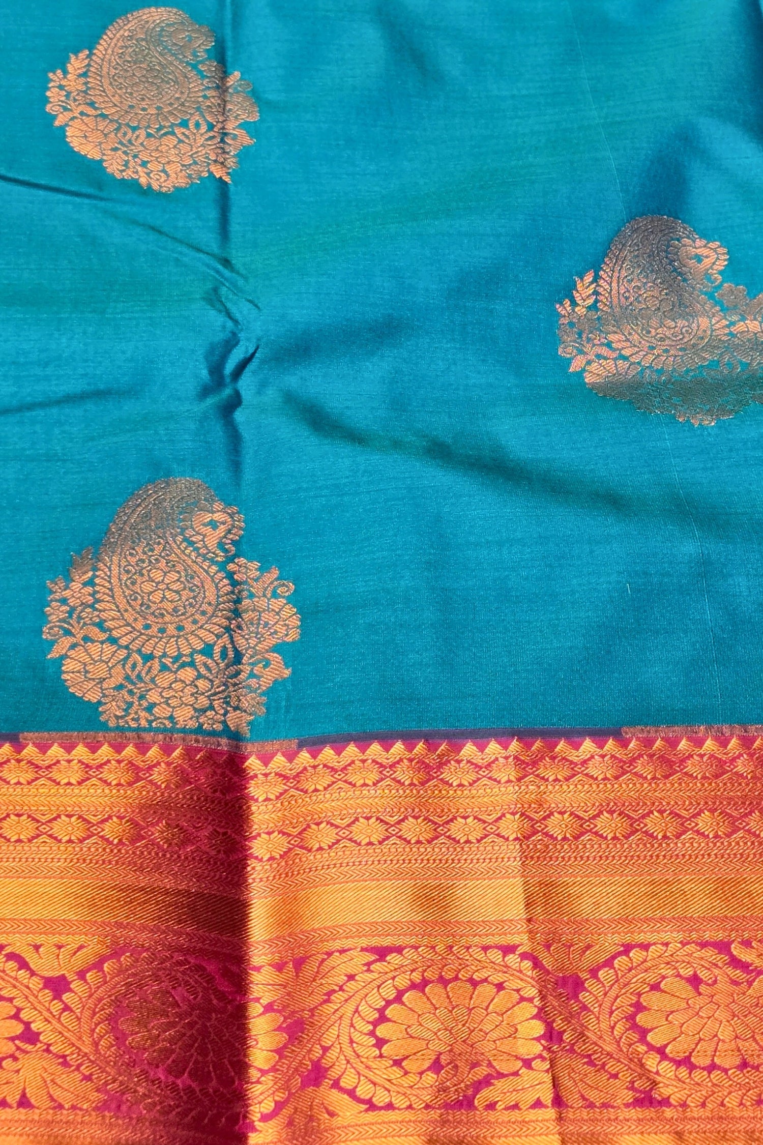 Blue fabric with gold and red patterns