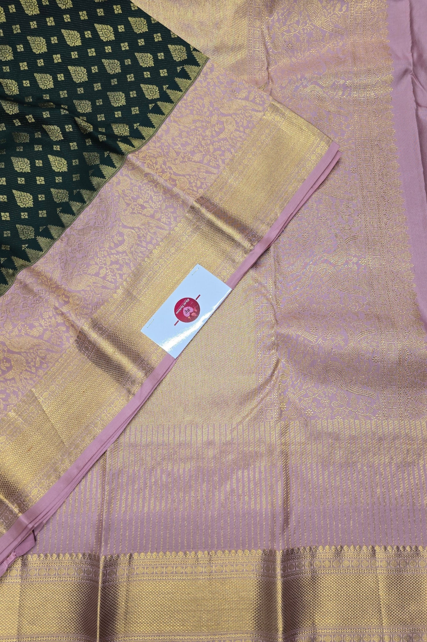 Majestic Dark Green Kanchipuram Silk Saree with Elegant Pink Border
