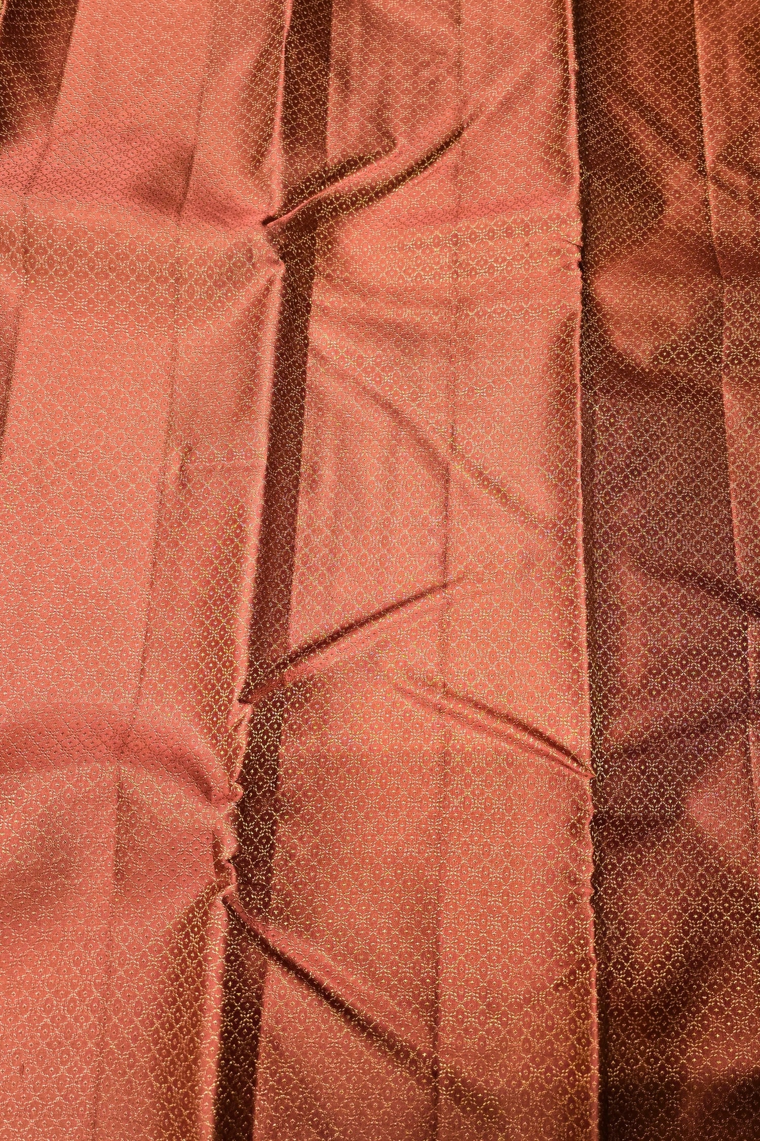 Close-up of a textured brown fabric with a pattern