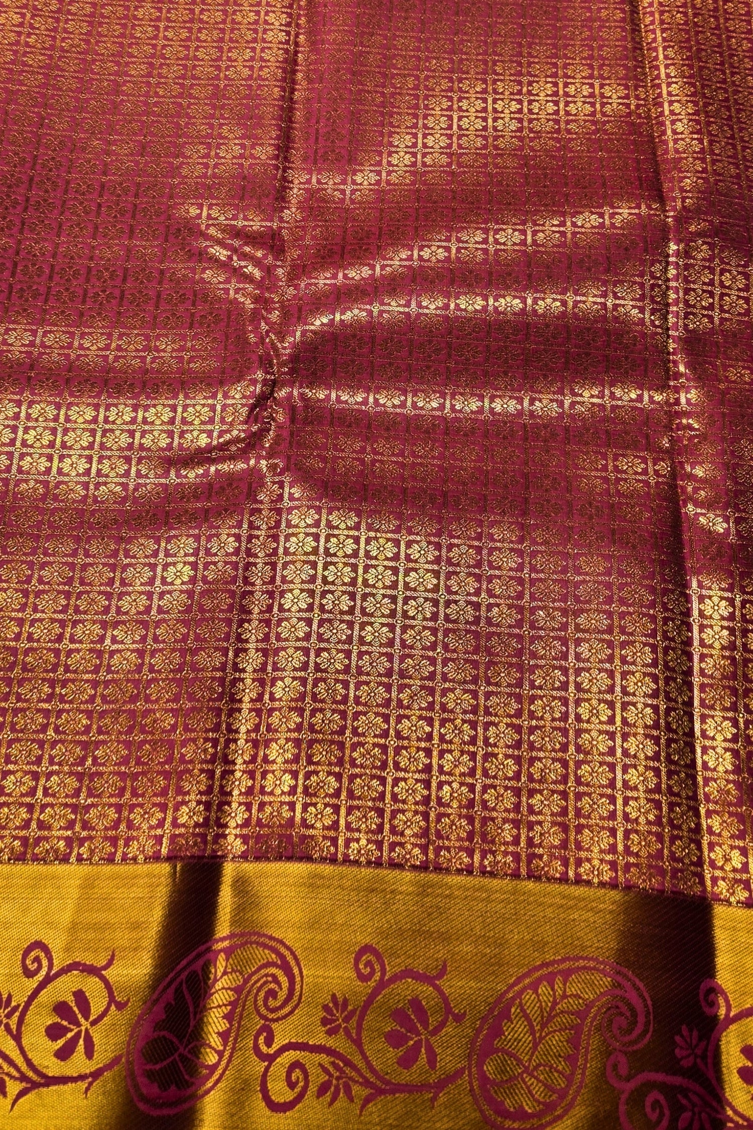 Patterned fabric with a maroon and gold design