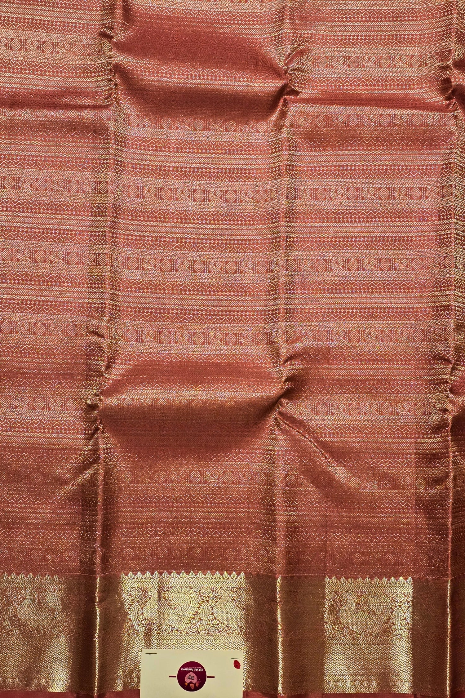 Patterned fabric with a visible brand label in the corner