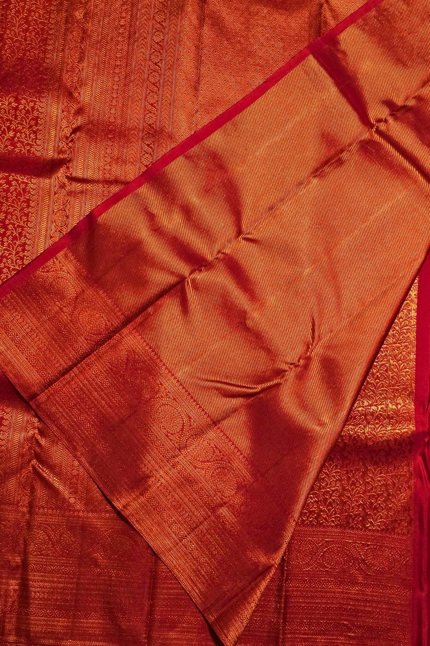 Close-up of a red fabric with intricate patterns