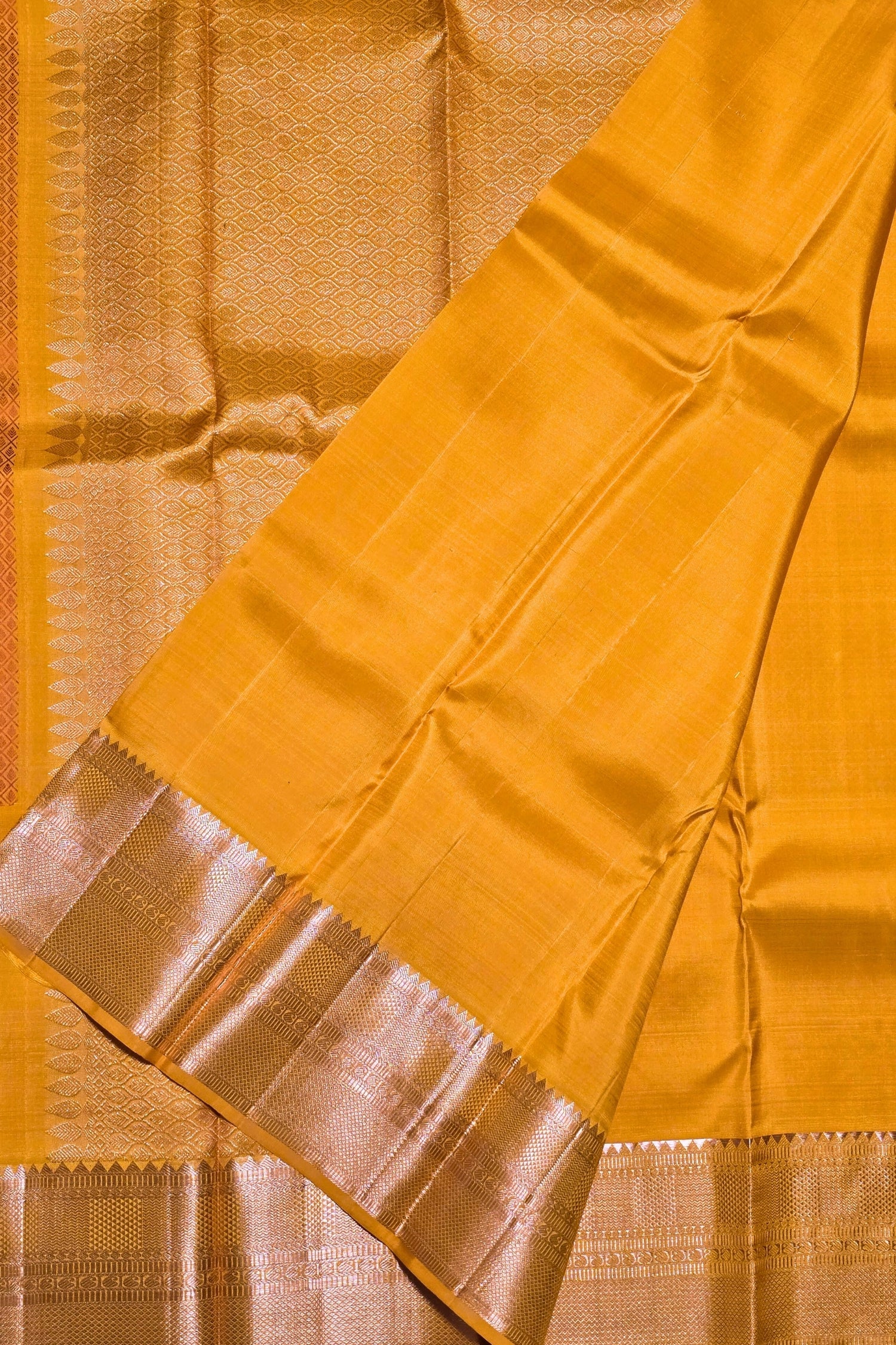 Mustard yellow saree with a metallic border