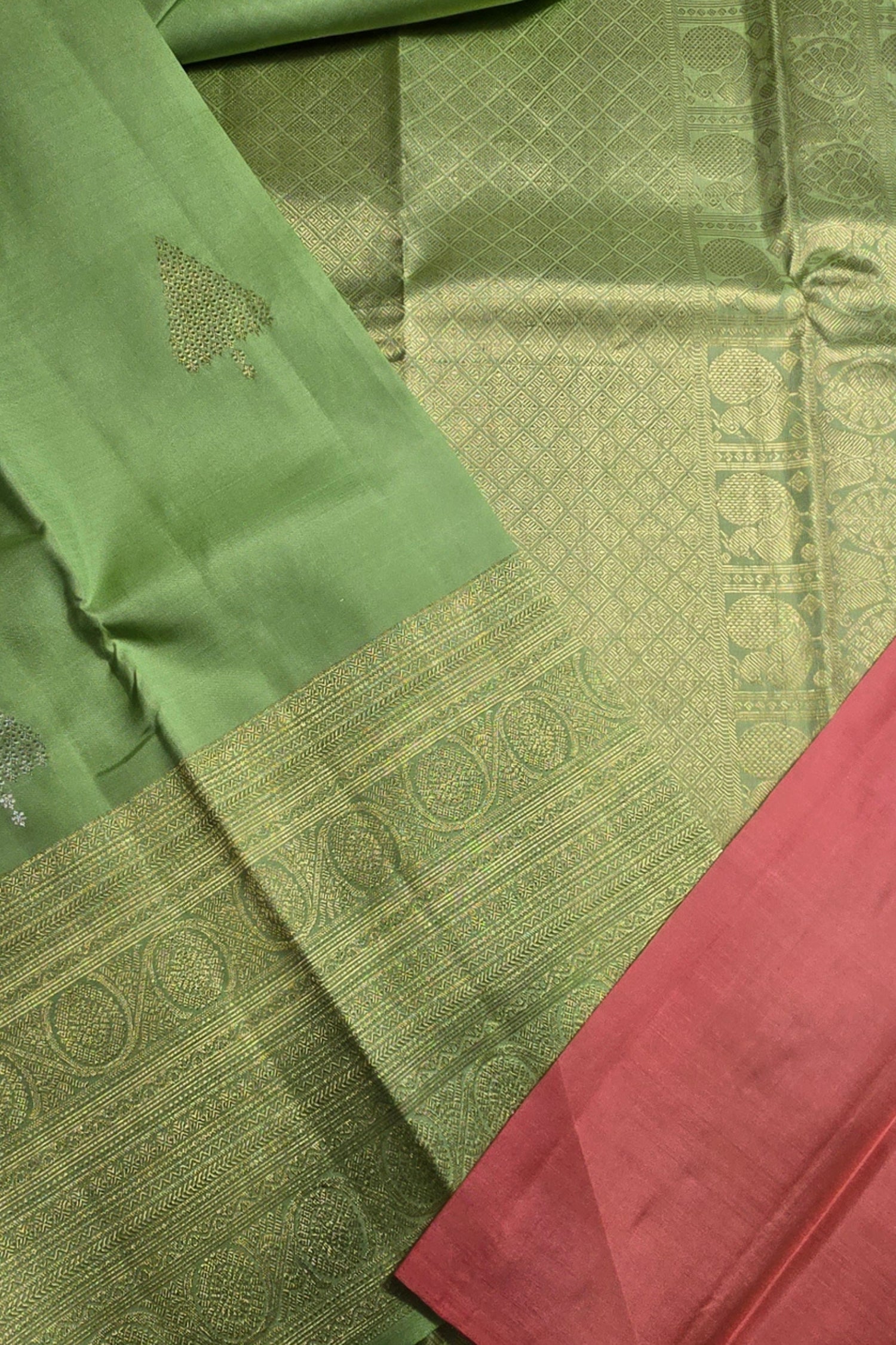 Green and red fabric with intricate patterns