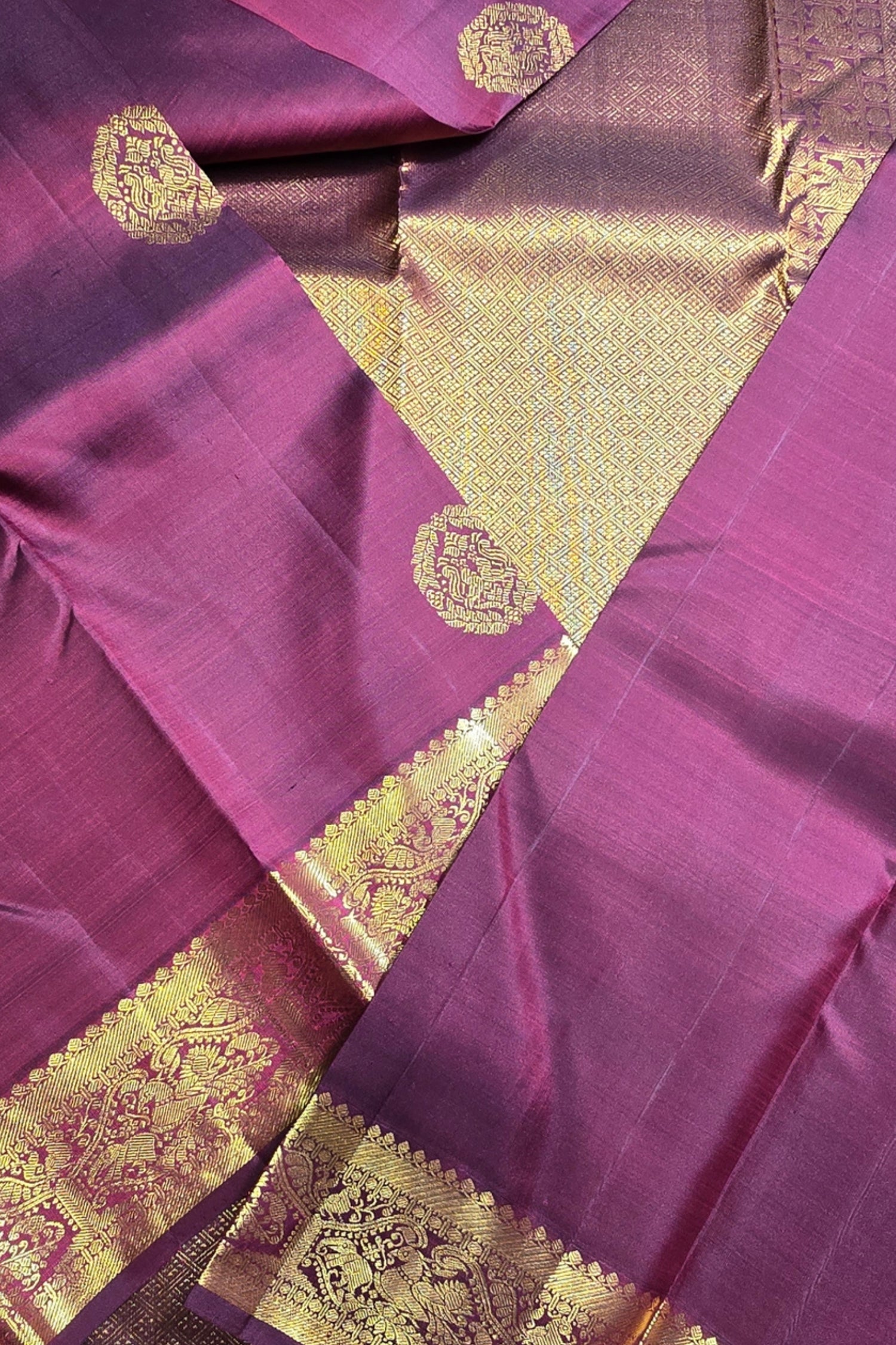 Purple fabric with gold intricate patterns
