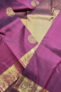 Purple fabric with gold intricate patterns