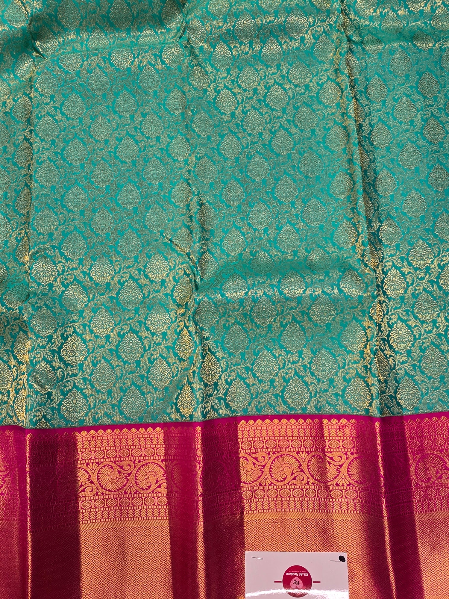 Green Kanjipuram Saree with Pink Border