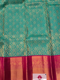 Green Kanchipuram Saree with Pink Border