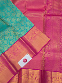 Green Kanchipuram Saree with Pink Border