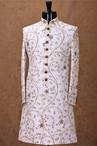White embroidered jacket on a mannequin against a brown background