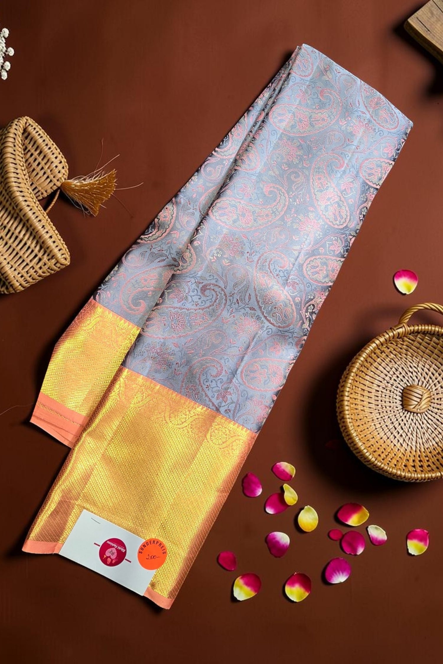 Saree with floral pattern on a brown background