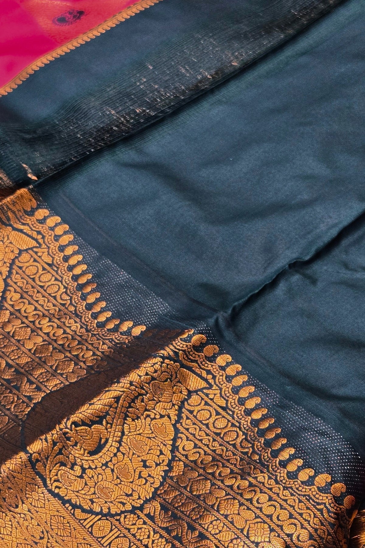 Navy blue fabric with gold embroidery