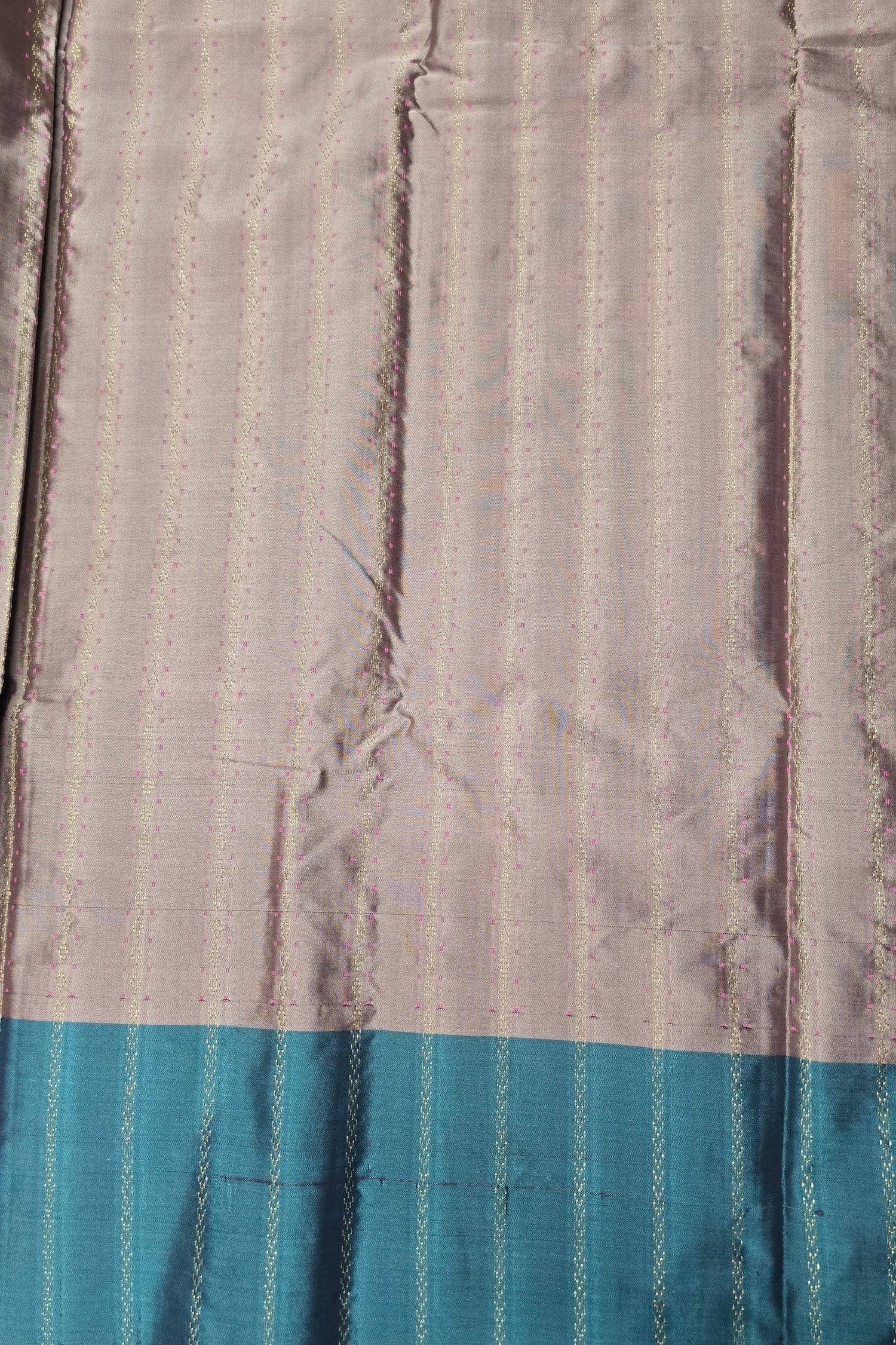 Textured fabric with a blue stripe at the bottom