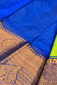 Blue fabric with gold embroidery and a green border