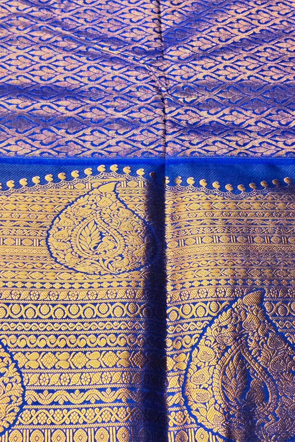 Close-up of a blue and gold patterned fabric