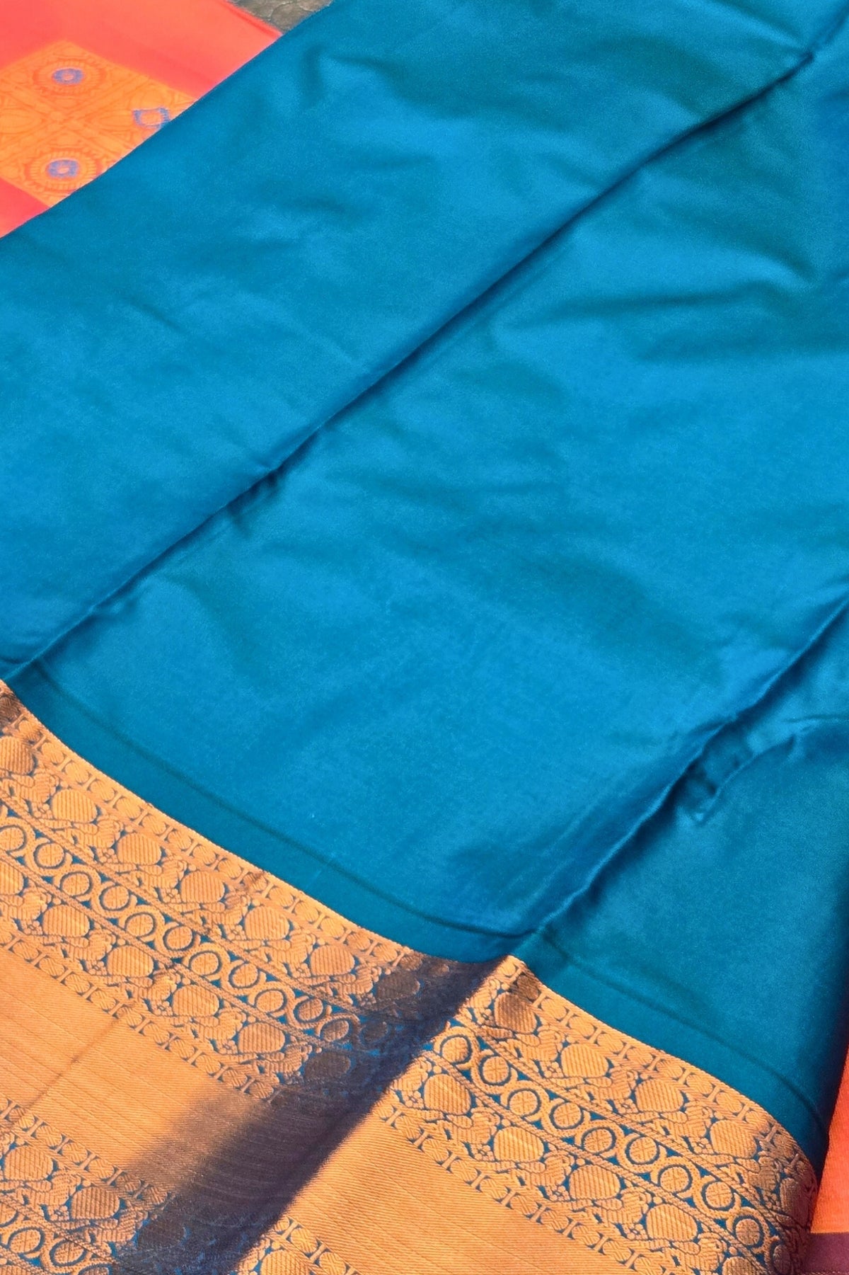Vibrant Orange Semi Kanchi Silk Saree with Sky Blue Border