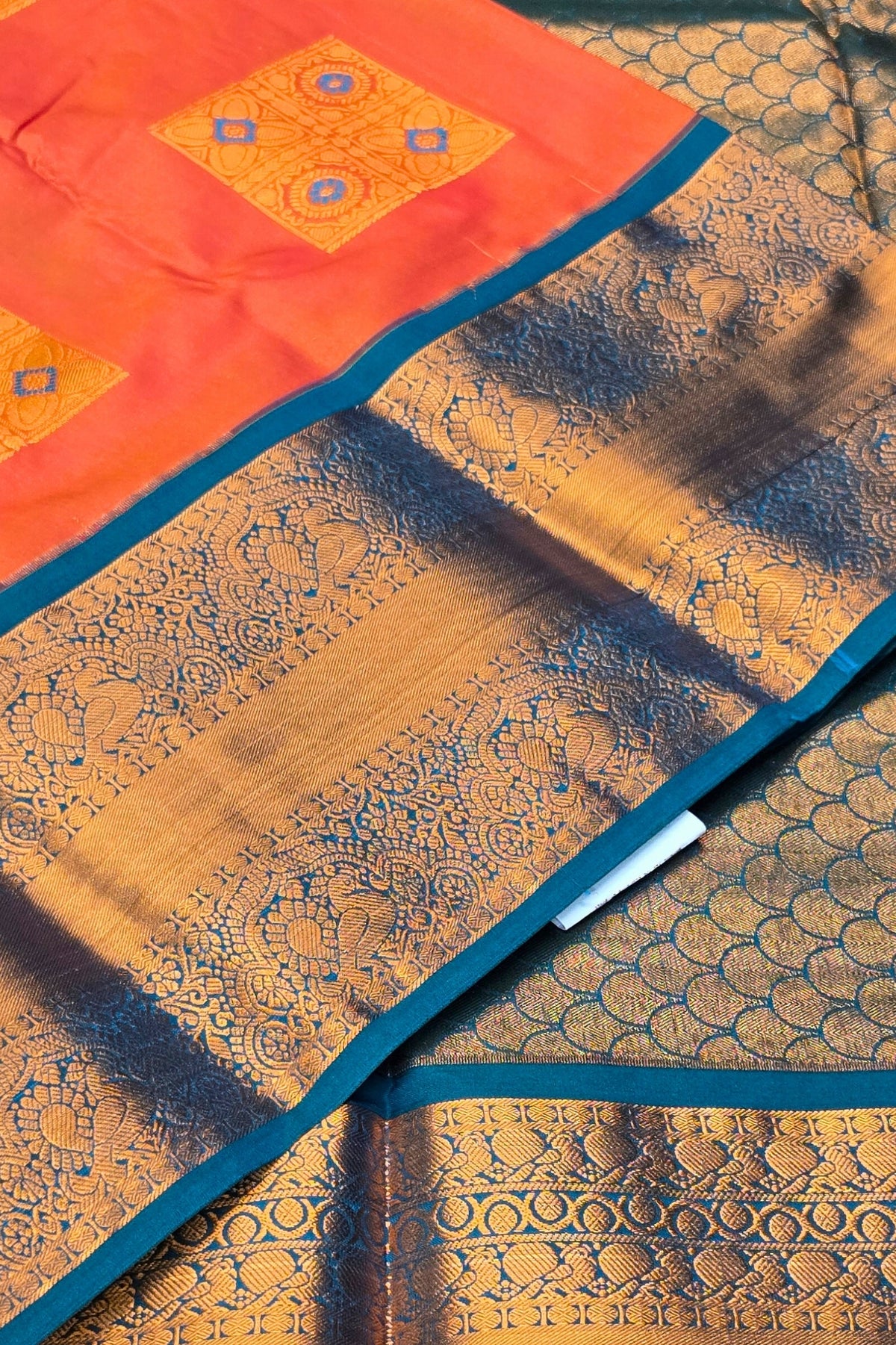 Vibrant Orange Semi Kanchi Silk Saree with Sky Blue Border