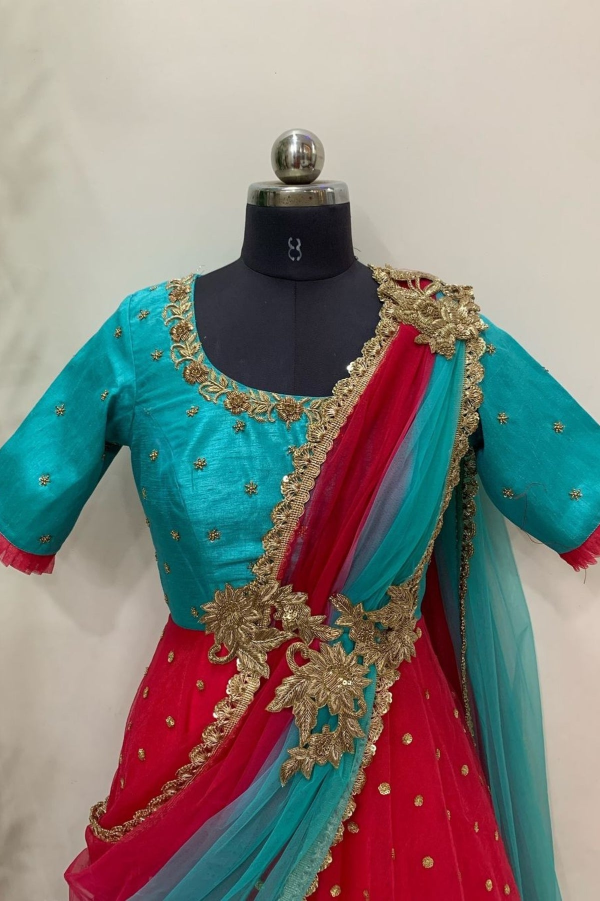 Timeless Contrast – Red Saree with Turquoise Blouse