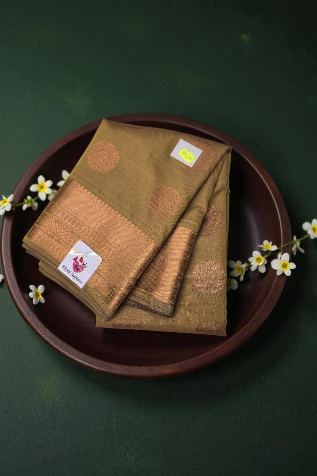 Brown fabric with floral patterns on a dark green background