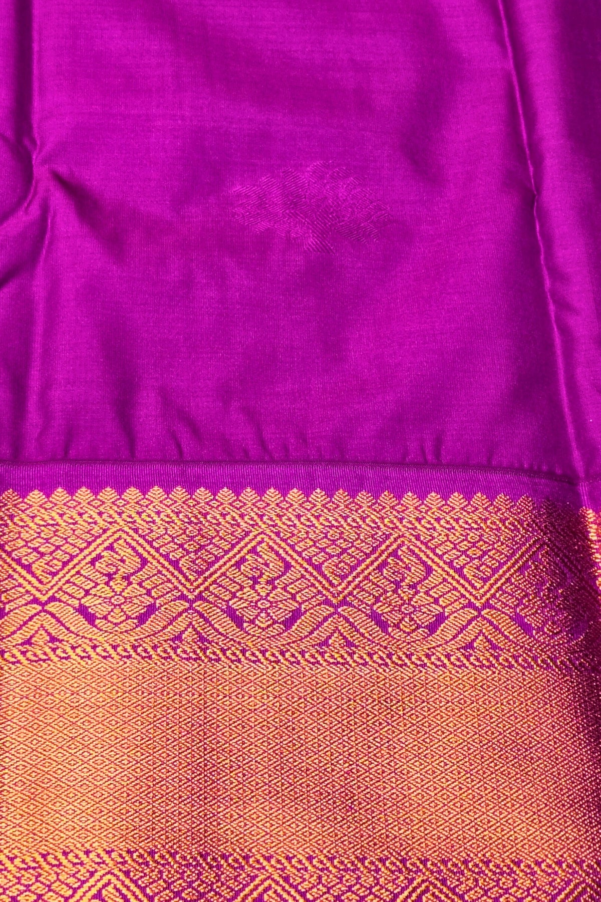 Purple and orange fabric with a decorative border