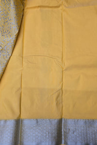Close-up of yellow fabric with a blue border