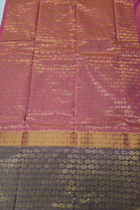 Fabric with a checkered pattern transitioning from pink to purple and green to blue.