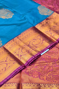 Blue and orange saree with intricate patterns