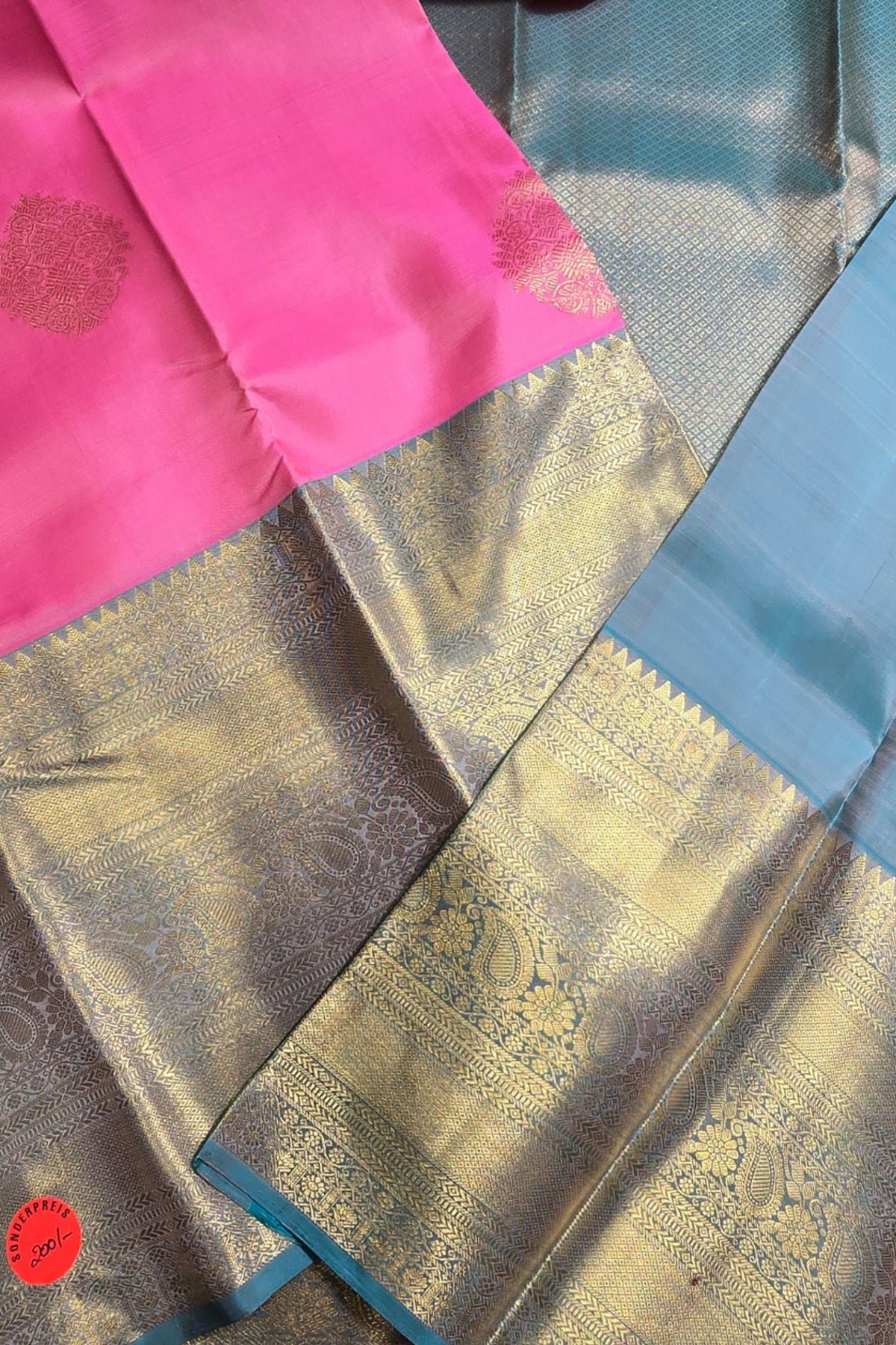 Traditional saree with pink, gold, and blue colors