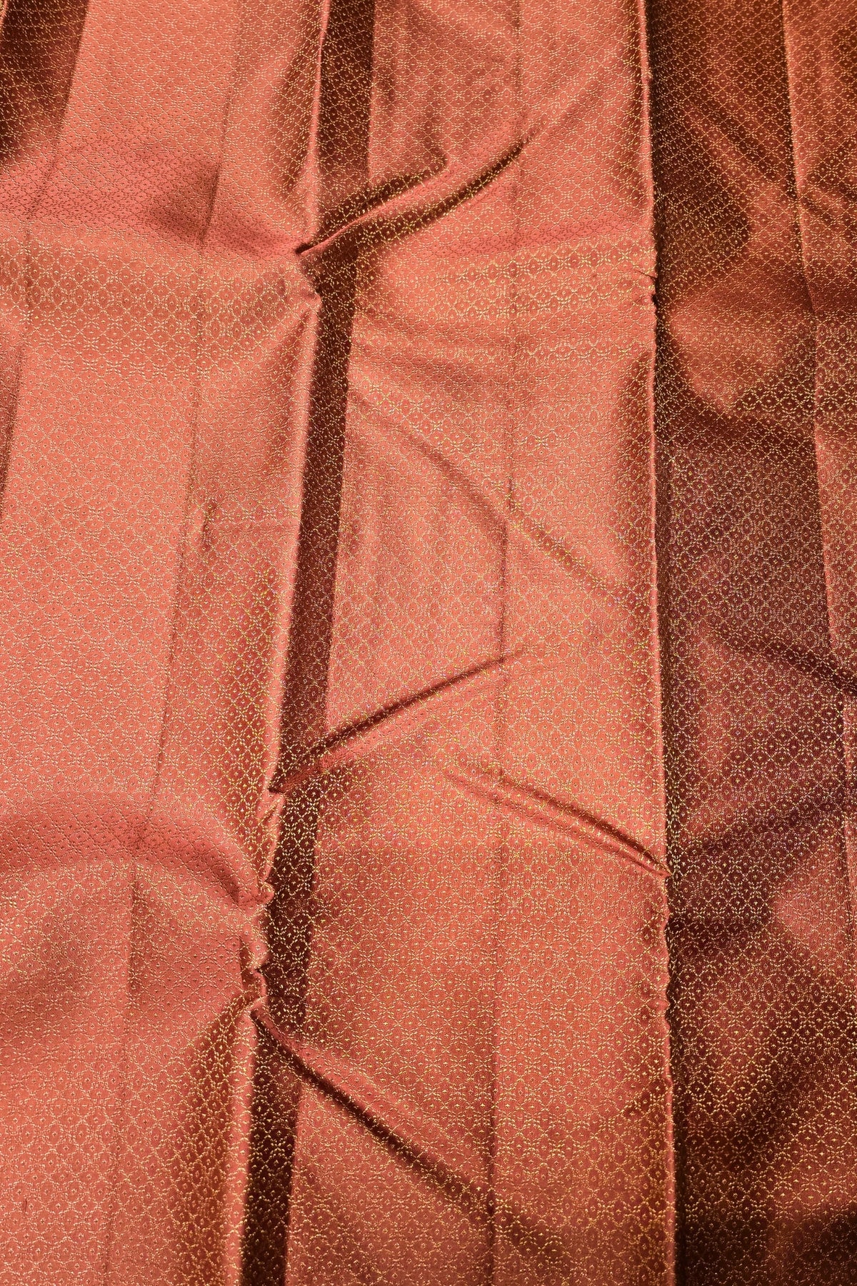 Close-up of a textured brown fabric with a pattern