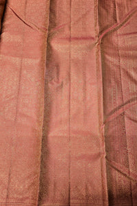 Close-up of a textured pink fabric with a subtle pattern