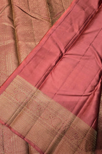 Close-up of a maroon saree with a brown border