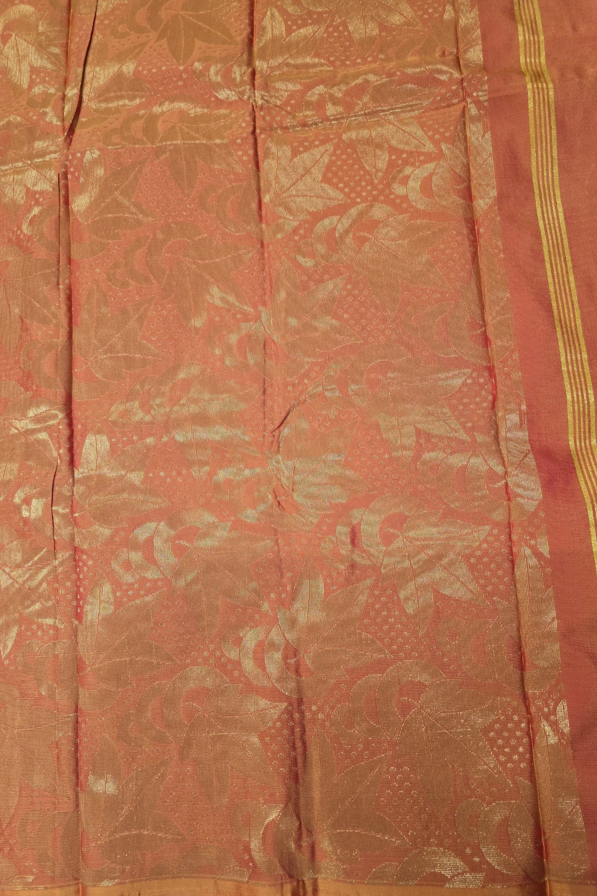 Red fabric with gold patterns and border
