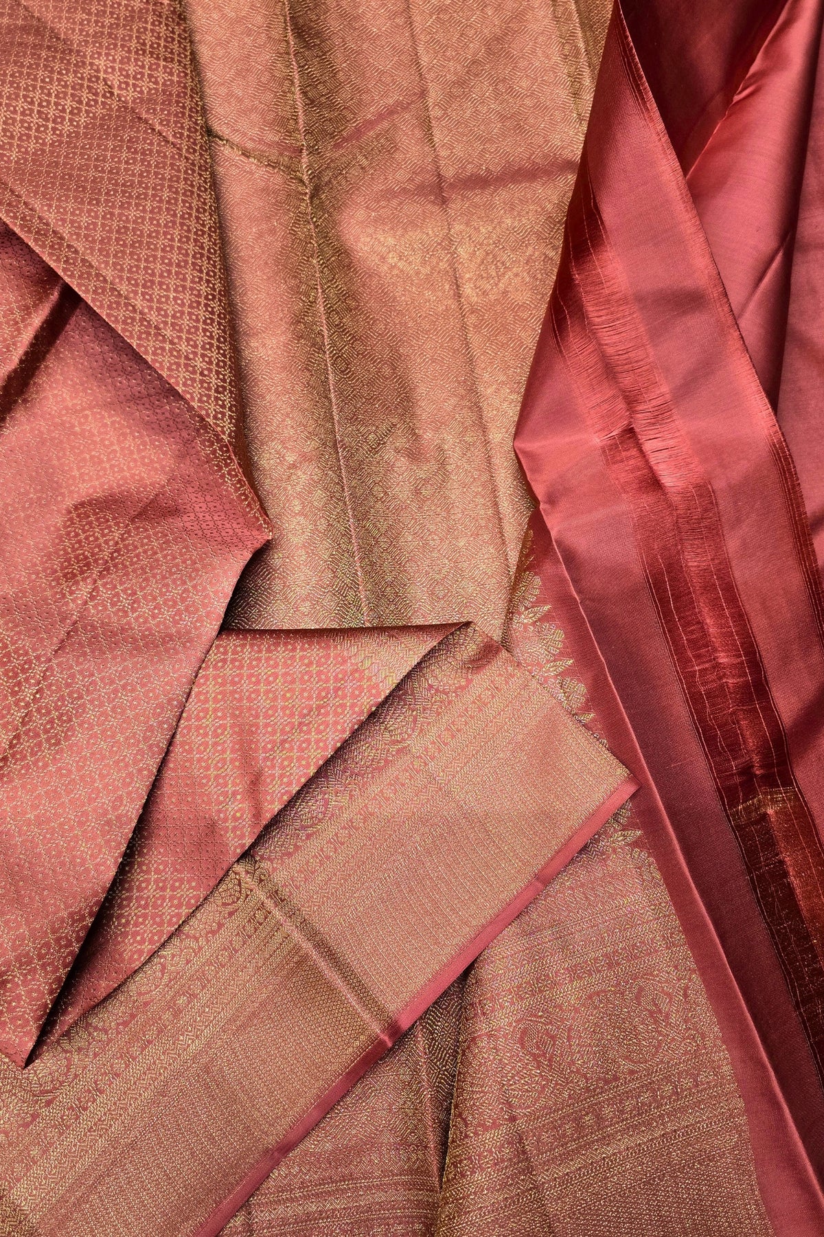 Close-up of patterned fabric in shades of pink and brown