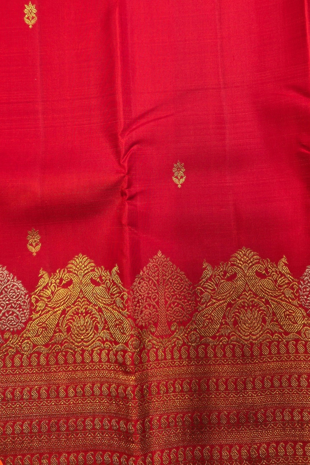 Red fabric with gold embroidery and patterns