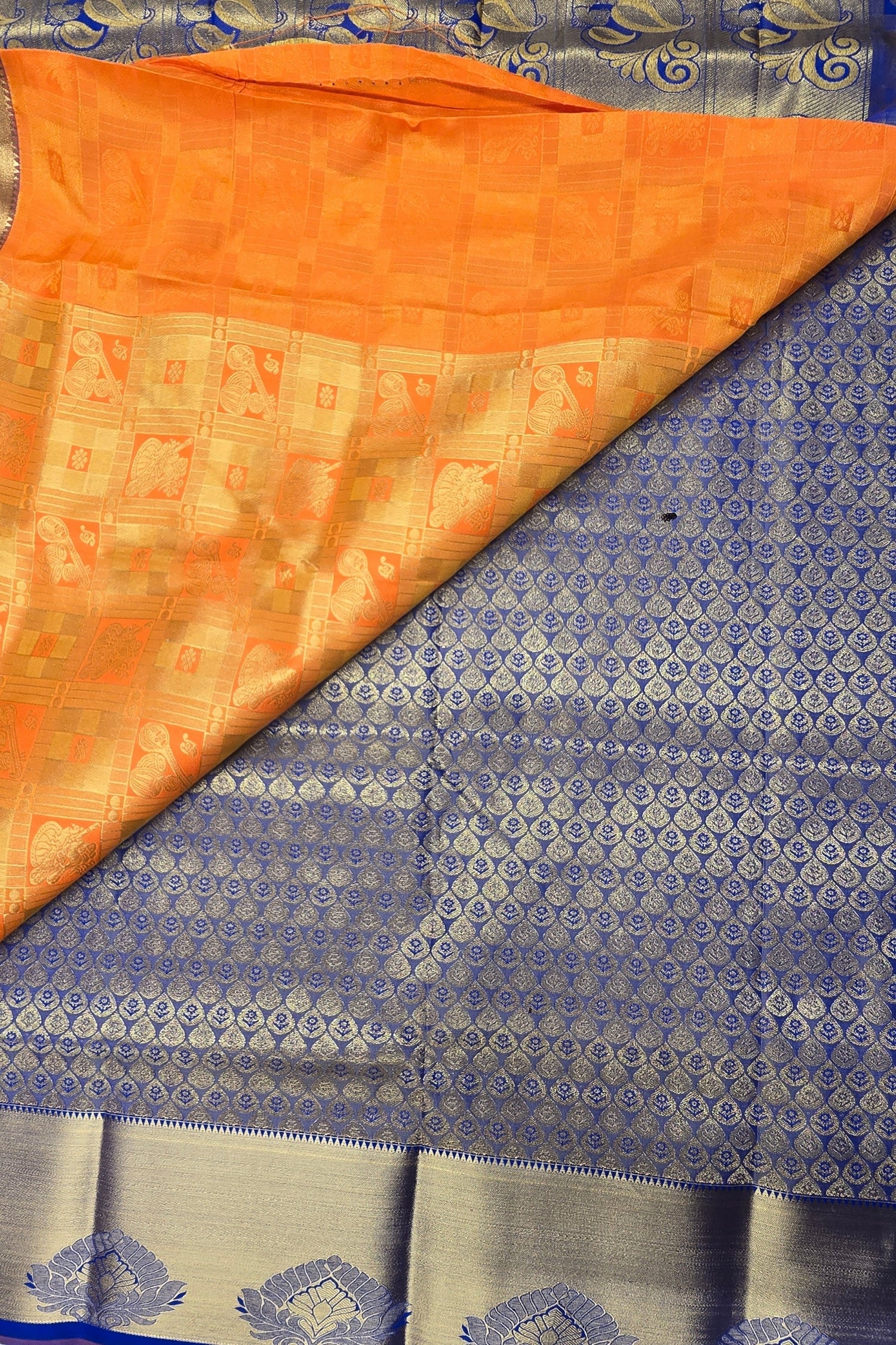 Orange and blue patterned fabric with a visible border