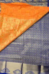 Orange and blue patterned fabric with a visible border