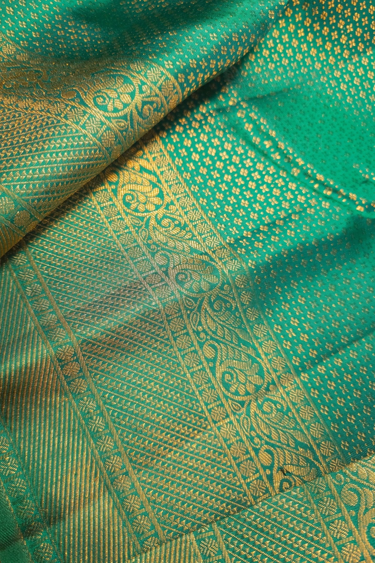 Sea Green Kanchipuram Silk Saree with Brocade Design showcasing intricate patterns and vibrant hue.