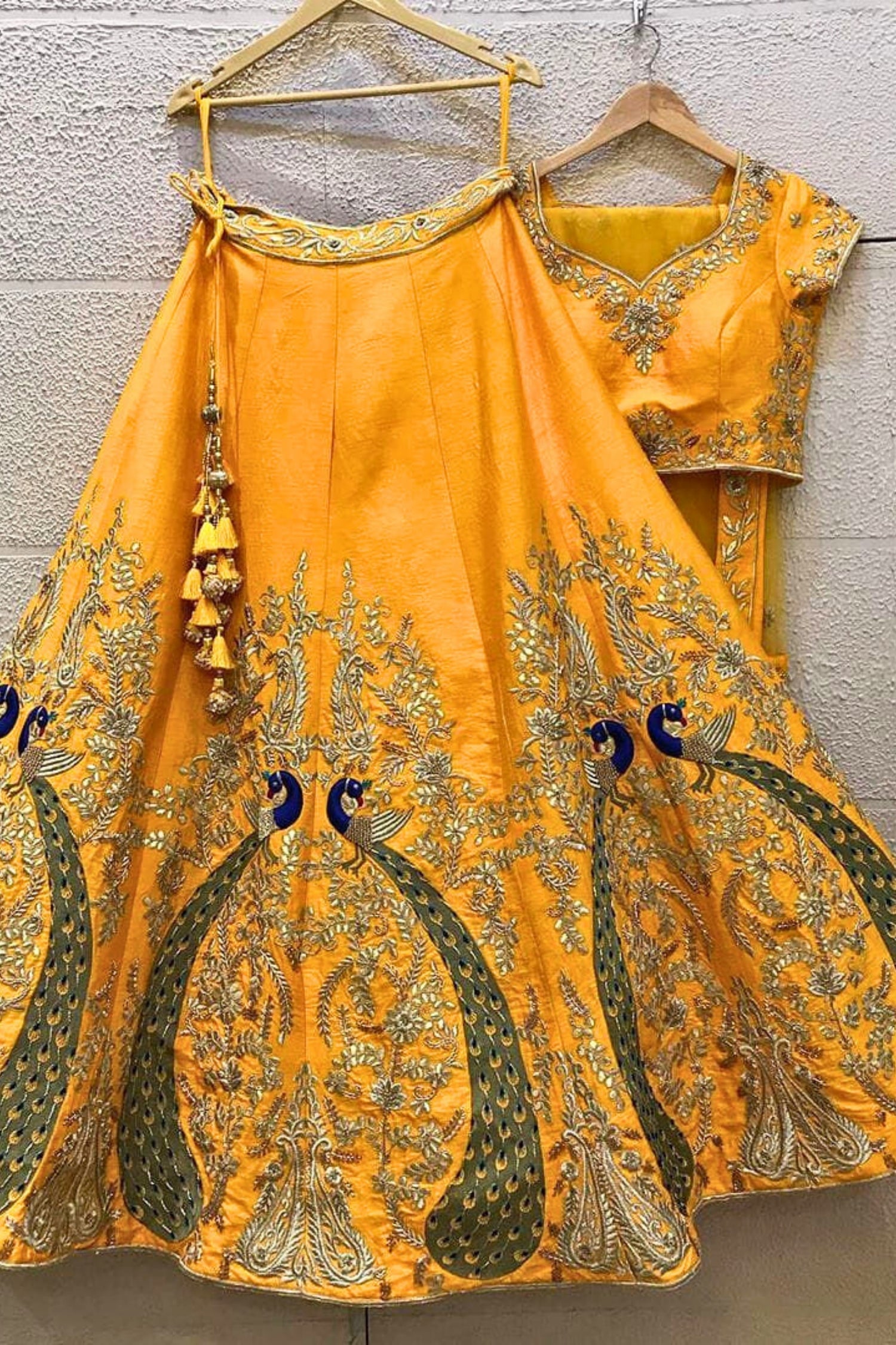 Radiant Yellow Lehenga with Exquisite Peacock Skirt Embroidery