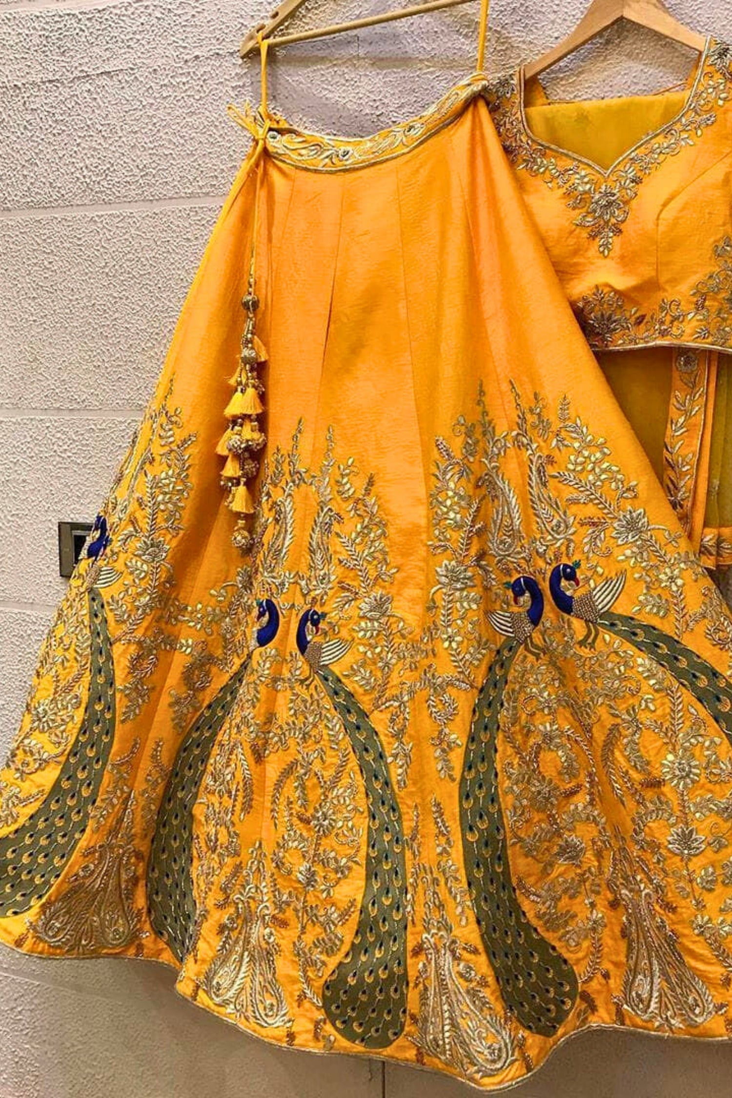Radiant Yellow Lehenga with Exquisite Peacock Skirt Embroidery