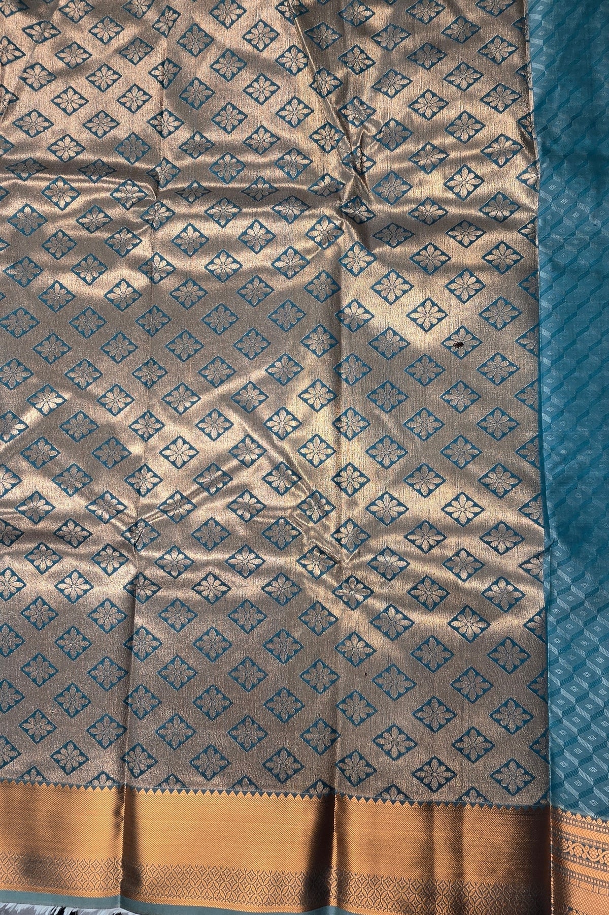 Patterned fabric with geometric design and blue border