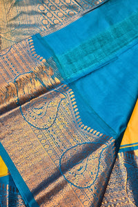 Blue and gold patterned fabric with a yellow border
