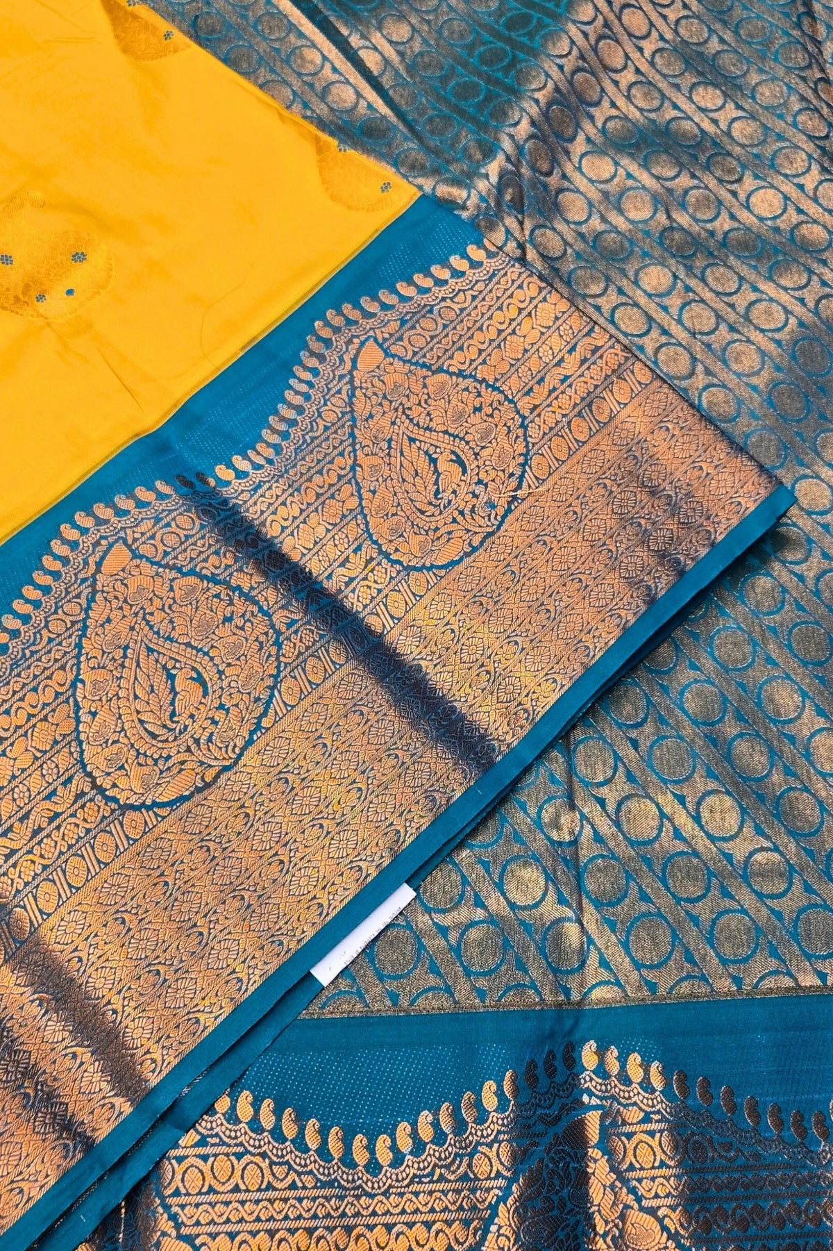 Blue and yellow patterned fabric with intricate designs