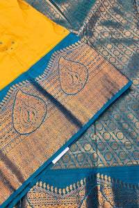 Blue and yellow patterned fabric with intricate designs