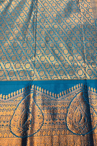 Blue and gold patterned fabric with intricate designs
