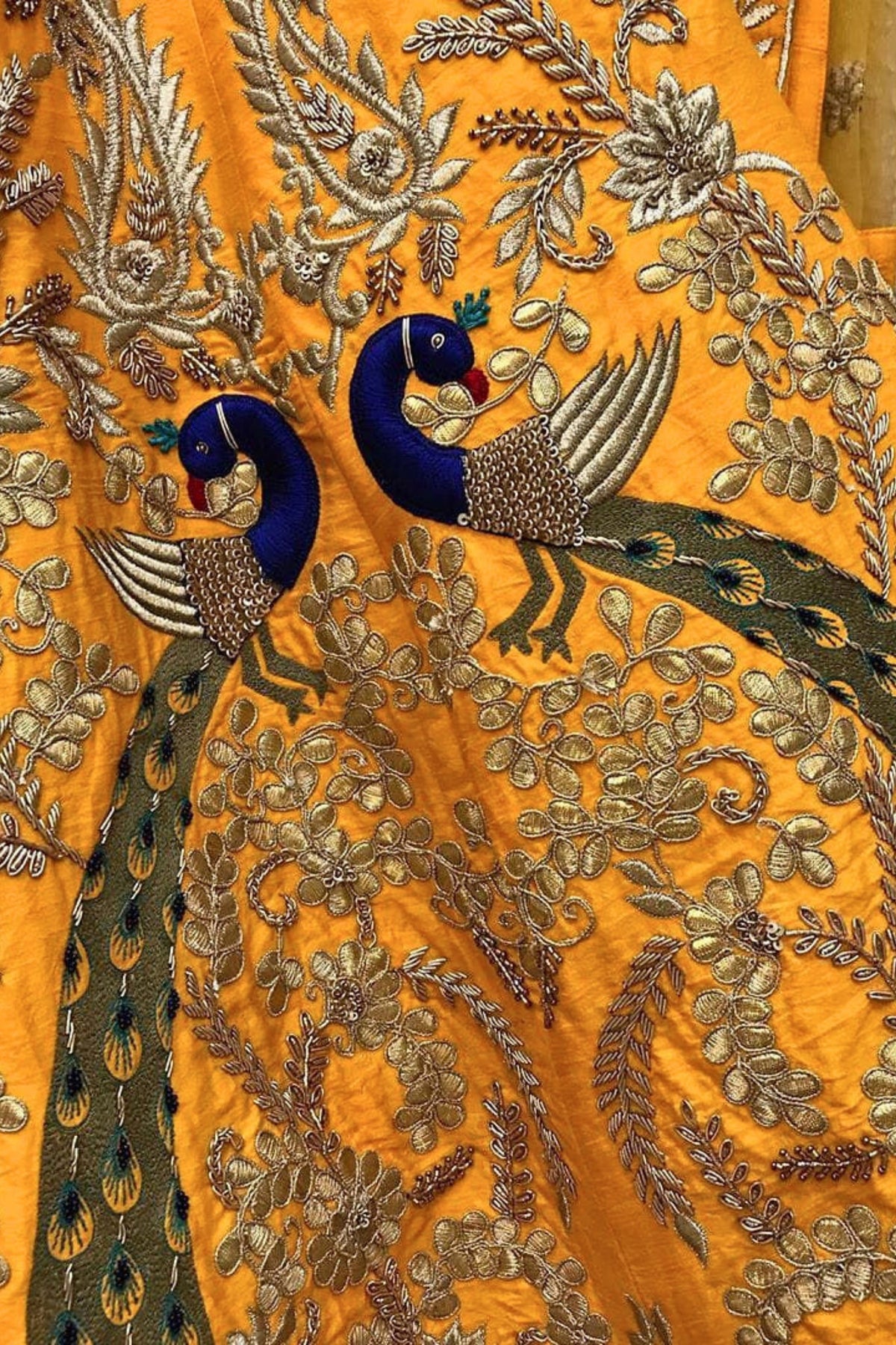 Radiant Yellow Lehenga with Exquisite Peacock Skirt Embroidery