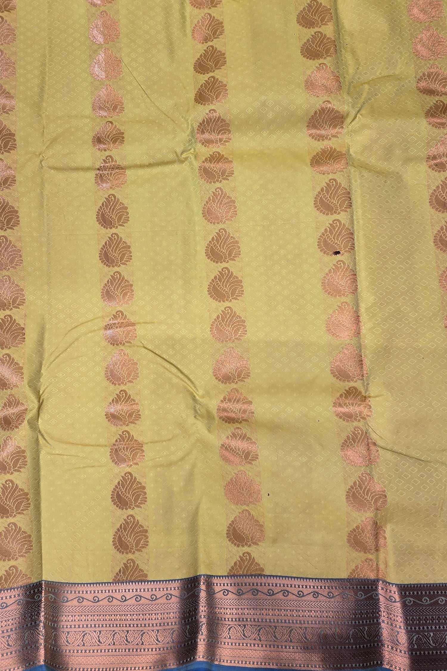 Light green fabric with pink and blue border patterns