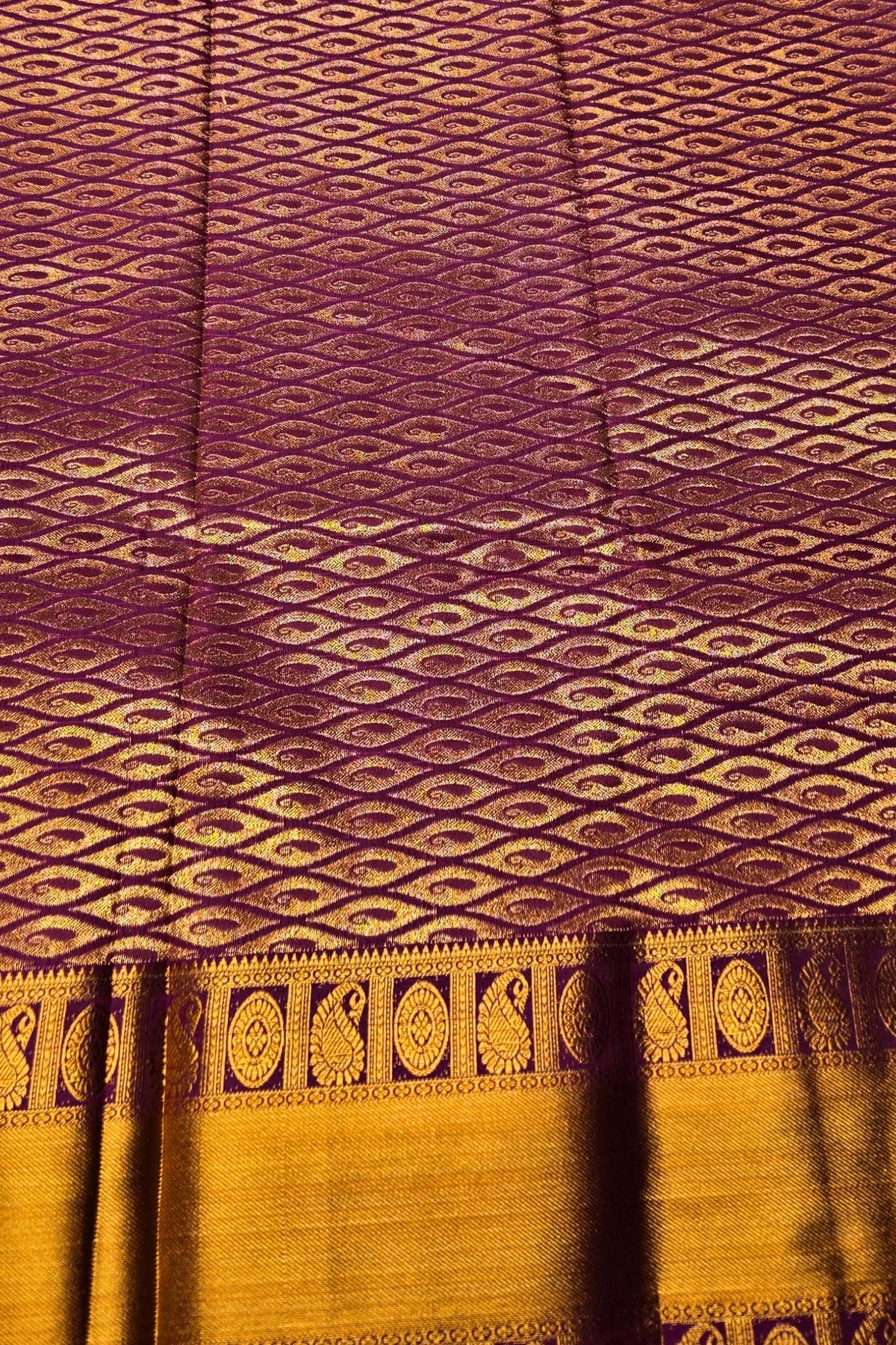 Patterned fabric with purple and gold colors