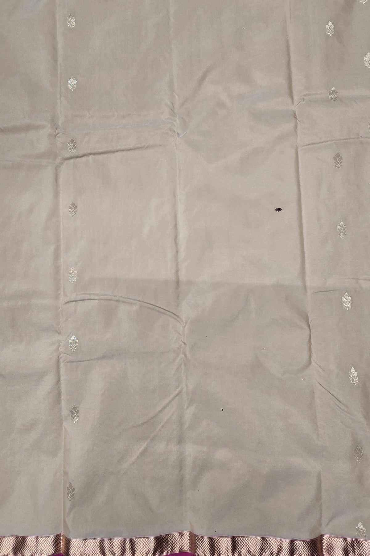 Gray fabric with floral patterns on a plain background