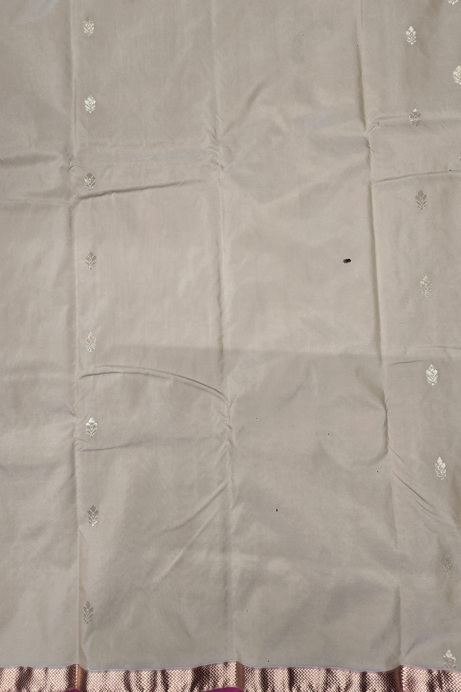 Gray fabric with floral patterns on a plain background